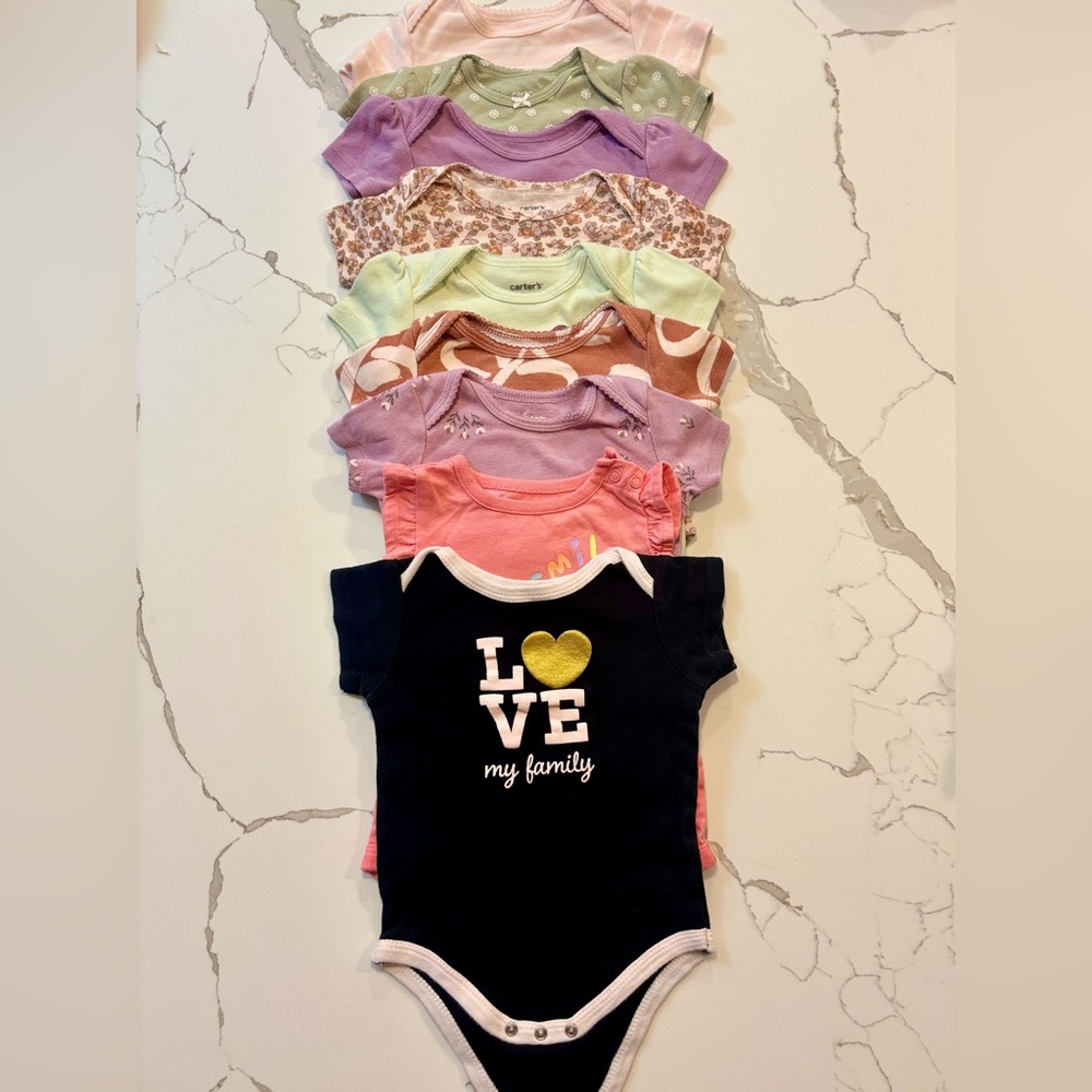 Set of 9 onesies. 9M.